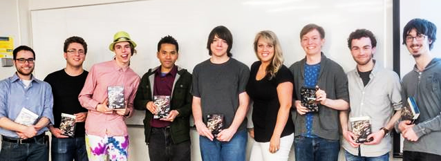 BioWare's Associate Recruiter, Shanda Wood, poses with the game of the year winners. Photo courtesy of Kevin Schenk and Vadim Bulitko.